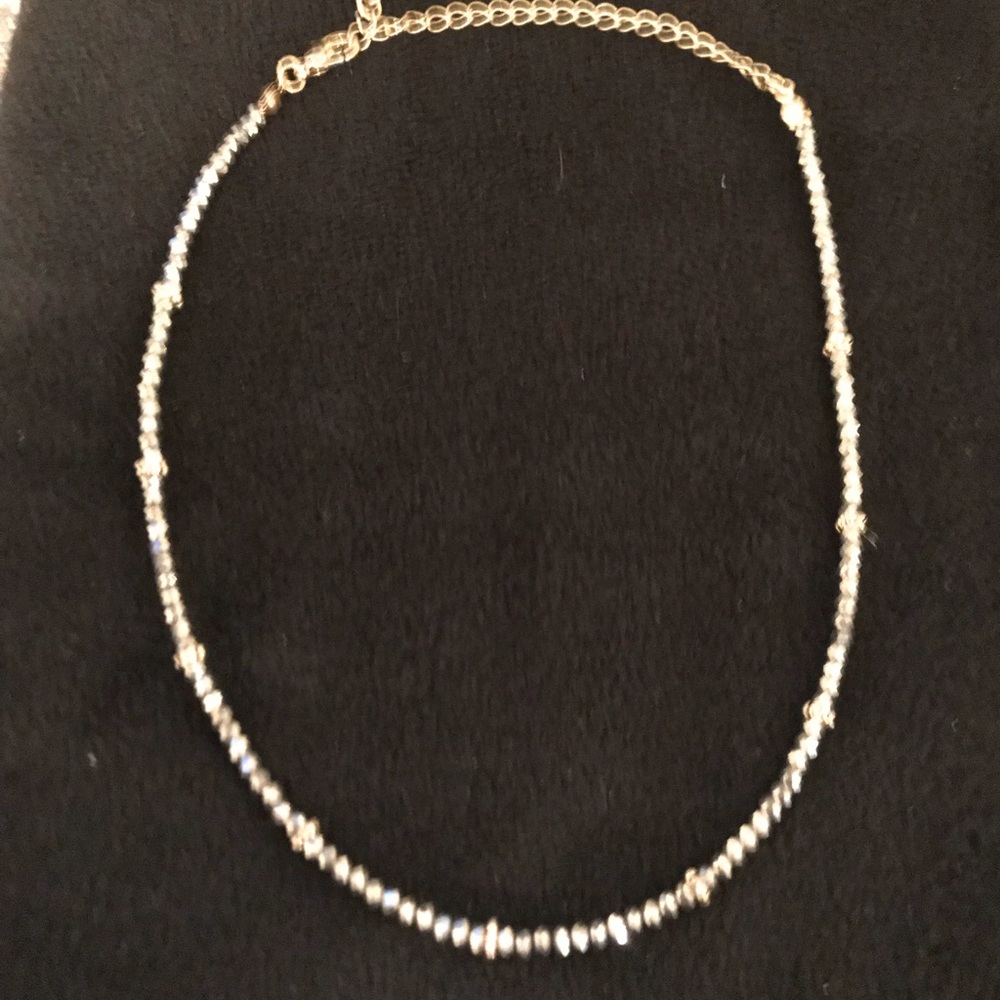 Grey onyx/gold fashion necklace.